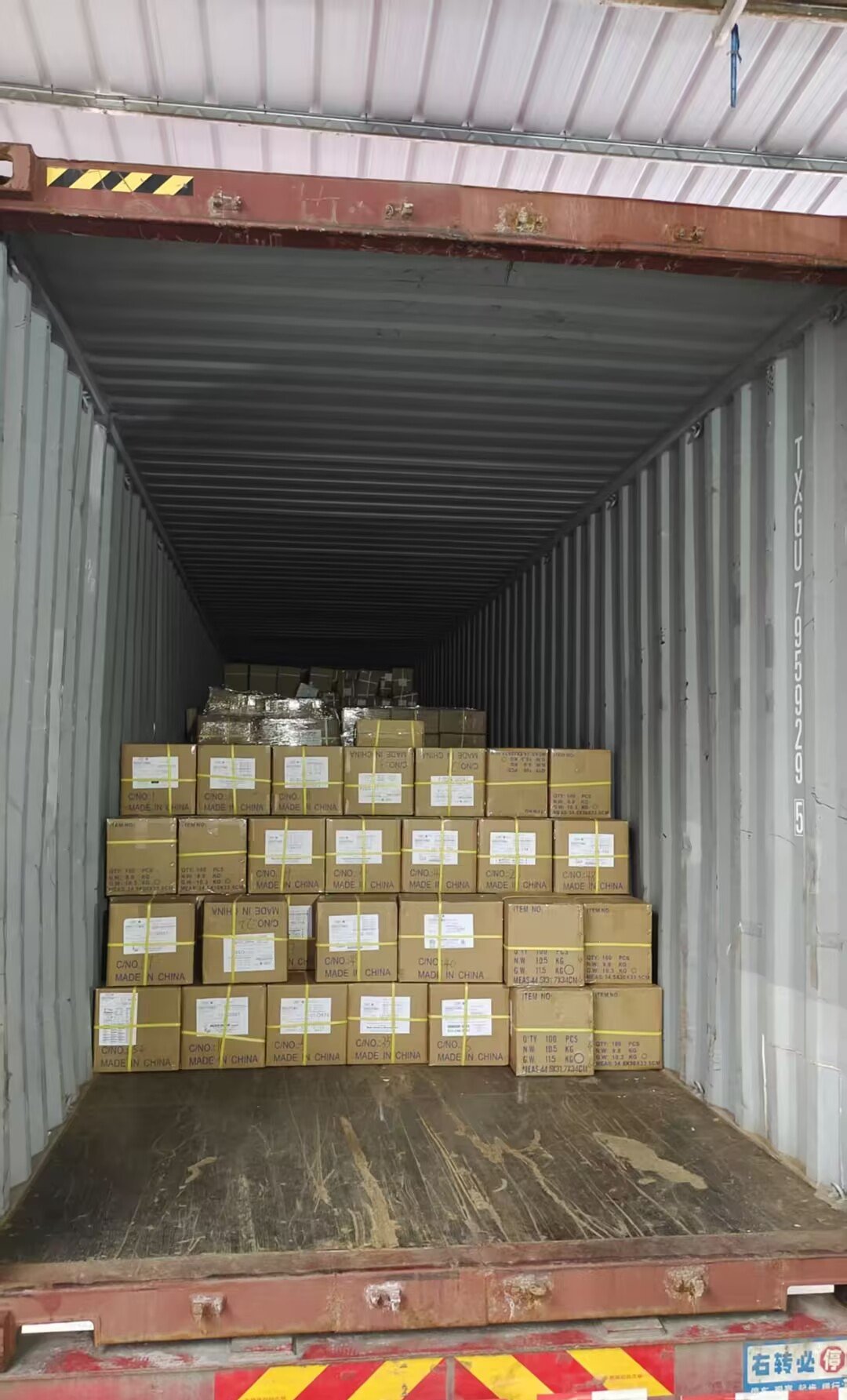 Cartons of children's books stowed inside a 40HQ container at Shenzhen warehouse, September 2026